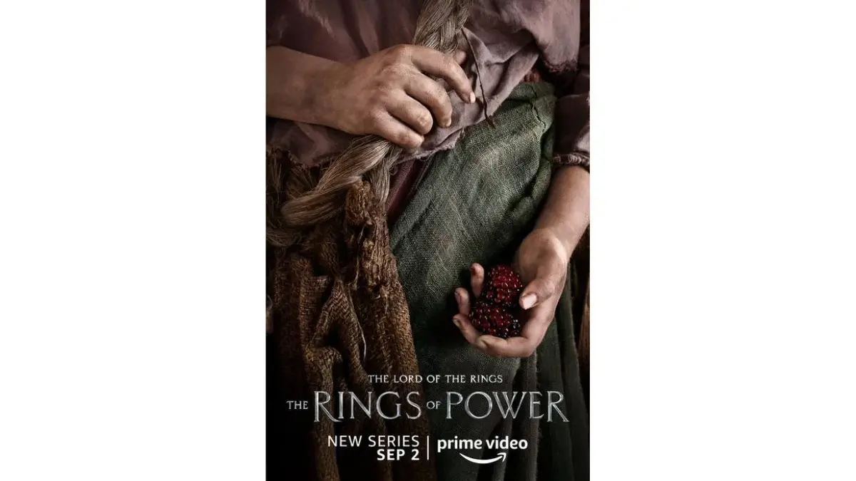 Plakat "Pierścienie władzy": dłonie z malinami