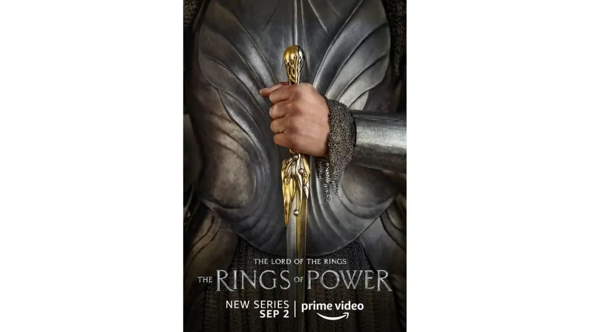 Plakat "Pierścienie władzy": dłoń ze złotym sztyletem
