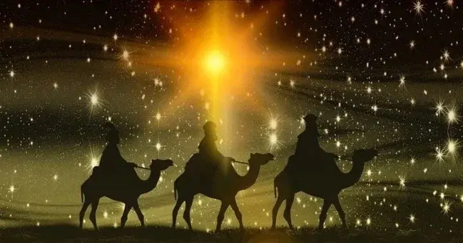 Trzech króli na tle złotej gwiazdy Betlejemskiej i ciemnego nieba
